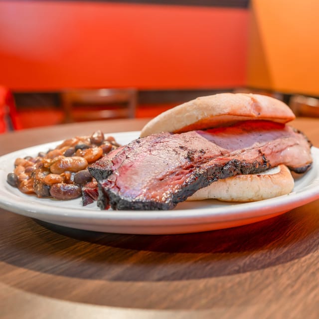 24-Hour Smoked Sliced Beef Brisket Sandwich.